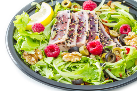 tuna sashimi with fresh salad , raspberry and nutの写真素材