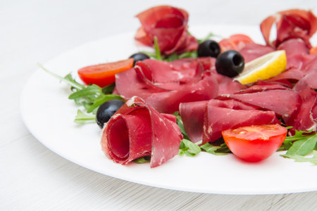 dish of bresaola and aragulaの写真素材