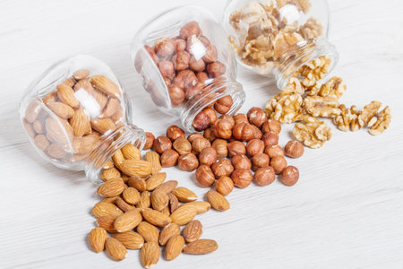 group of jar with hazelnut,nut,and almondsの写真素材