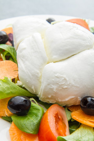 fresh italian mozzarella with mixed saladの写真素材