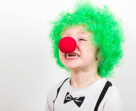 little boy wearing clown object for carnivalの写真素材