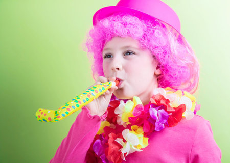 little girl wearing carnival maskの写真素材