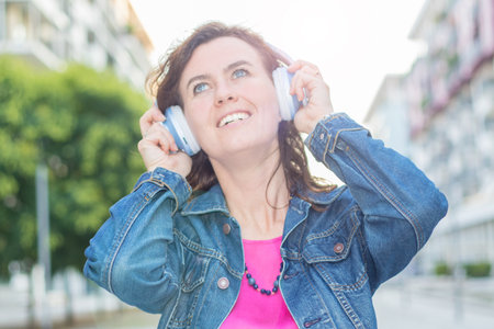 beautiful woman listening music with headphoneの写真素材