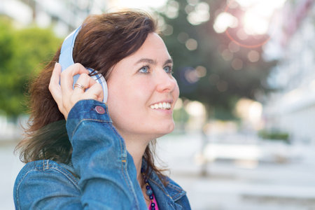 beautiful woman listening music with headphoneの写真素材