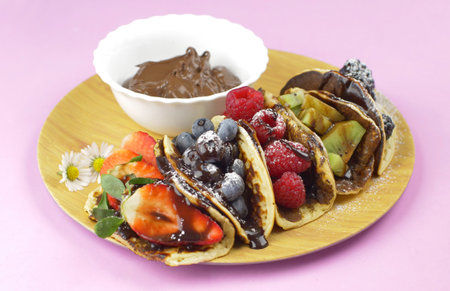 Classic American pancakes with fresh fruits. Summer homemade breakfast.の写真素材