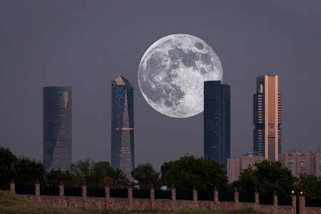 Views of the moon between the four towers of Madridの写真素材