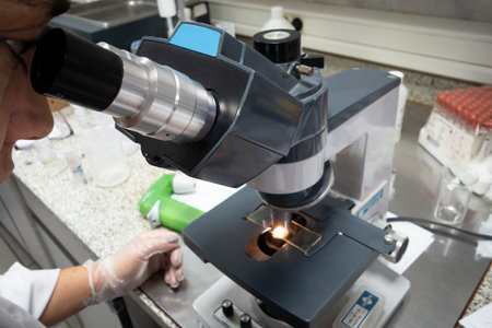 Observing in a laboratory through a microscope