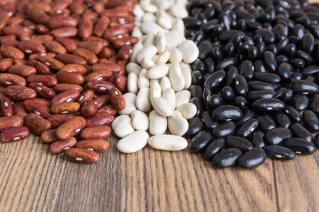 multicolored grains beans on wooden table