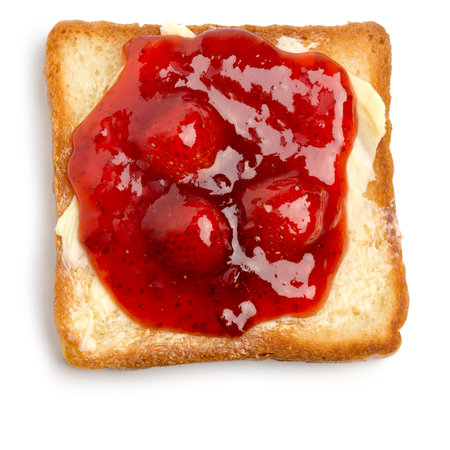 toast with butter and strawberry jam on a white backgroundの写真素材