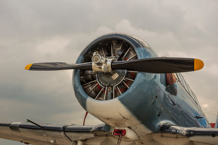 propeller aircraft against a background of stormy sky