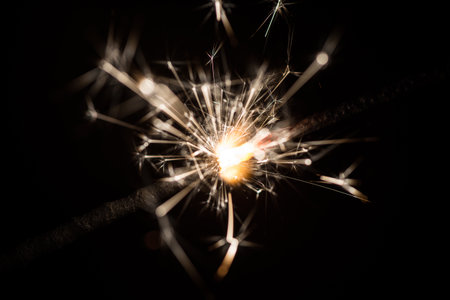 sparkler or Bengal fire on a dark backgroundの写真素材