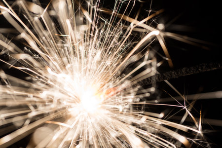 sparkler or Bengal fire on a dark background