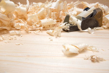 Hand jointer and shavings on pine boardsの写真素材