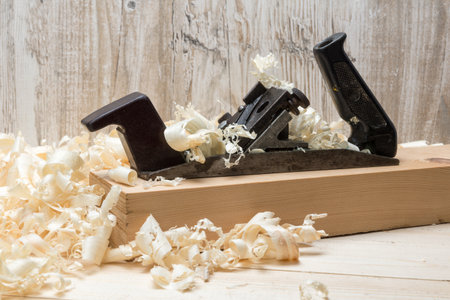 Hand jointer and shavings on pine boards