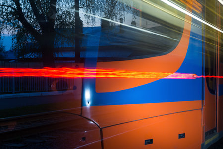 houses of the old city are reflected in the windows of the tram