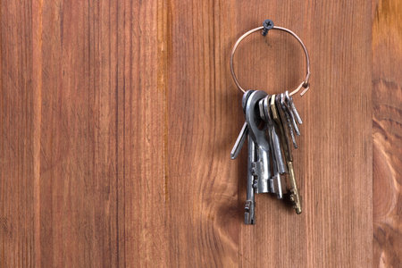 retro keys hanging on a wooden wallの写真素材
