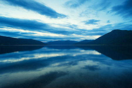 Lake in the mountains at sunset, Norway. Long exposure photo.