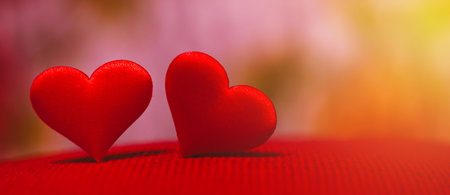 Valentine's Day background with red heart on a beautiful background with multicolored bokeh. Love...