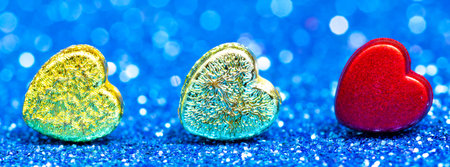 Valentine's Day background with red heart on a beautiful background with multicolored bokeh. Love...