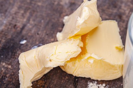 Butter on wooden rustic table. Close upの写真素材