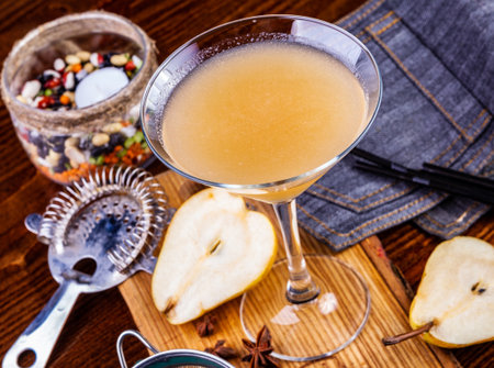 Pear cocktail in martini glass on wooden table. Close upの写真素材