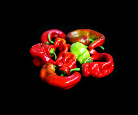  Pepper isolated against a black background