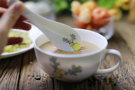 a bowl of wheat soup as breakfastの写真素材