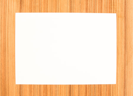 Paper sheet on wood board.の写真素材