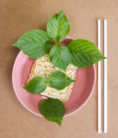 Dried noodle with vegetable in ceramic bowl.の写真素材