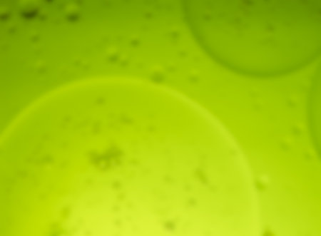 Closeup shot of oil drop on water surface ,process in soft style for background.の写真素材