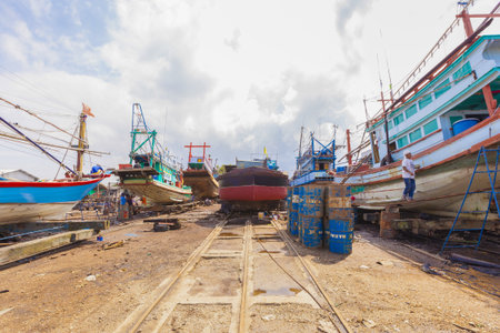Surat Thani, Thailand - January 15, 2015: Workers and Fishing boat at shipyard, Surat thani THAILAND on January 15. -( Selective Focus )のeditorial素材
