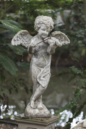 Cupid Statue sculpture in the garden.の写真素材
