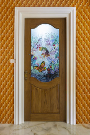 Teak wood door with mirror glass - Background.の写真素材