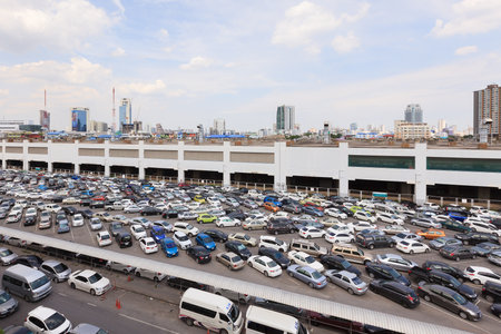 BANGKOK, THAILAND - July 24, 2015: parking lot and skyline next to Chatuchak Market on July 24, 2015 in Bangkok. Chatuchak weekend market is the largest in Thailand with 200,000 visitors per day.のeditorial素材