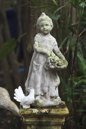 Cupid Statue sculpture in the garden.の写真素材