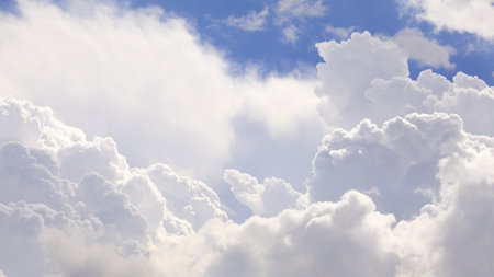 The vast cumulus clouds and blue sky.の写真素材