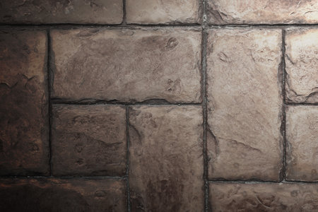 Stone Tile Cement Brick Wall Background Texture with Lighting from Above side.の写真素材