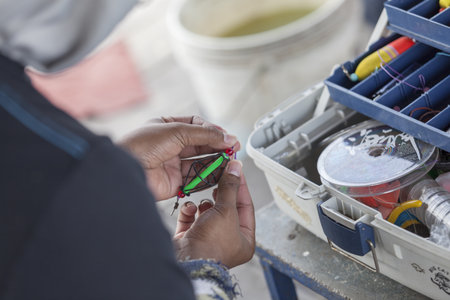 Fisherman is making a bait fish.の写真素材
