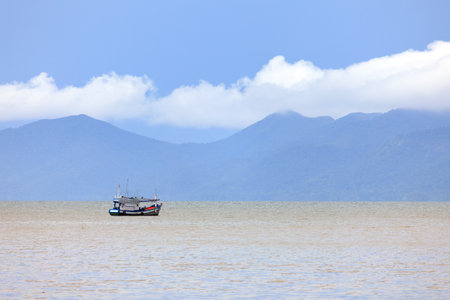 Lonely of fishing boat sailing in the sea.の写真素材