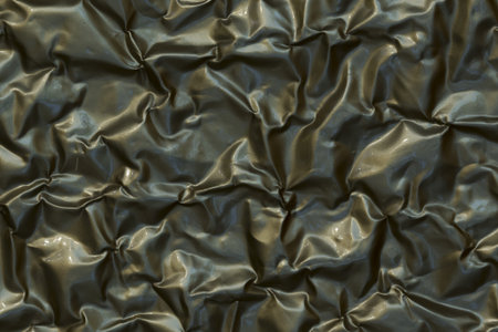 Close-up of crumpled aluminium foil background texture.の写真素材