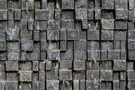 Seamless stone wall background with the motion water fall blur - texture pattern for continuous replicateの写真素材