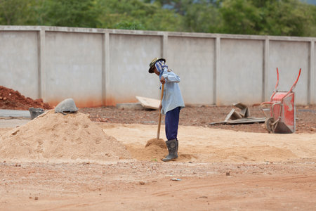 Kanchanaburi, Thailand - July 28, 2015: Shallow of depth to Worker are working on a Construction site.のeditorial素材