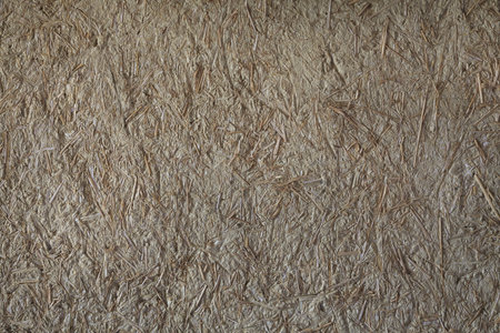 Rice straw on Stone Wall Background Texture.