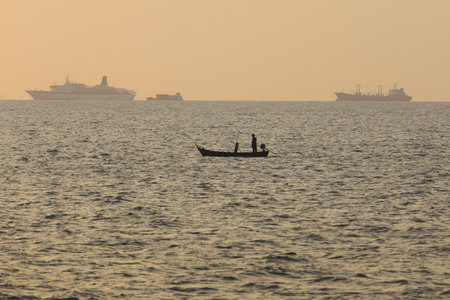Silhouette of Boats in the sea at sunset time.の写真素材