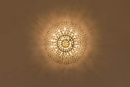 Lamp chandelier hanging from the ceiling in warm tone. - (Close up and Ant eye view)