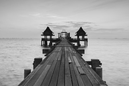 The wooden Bridge and pavilion into sea at the Djittabhawan Temple Chonburi , Thailand.の写真素材