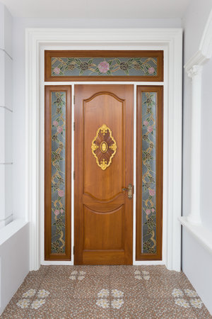 Teak wood door with mirror glass - Background.の写真素材
