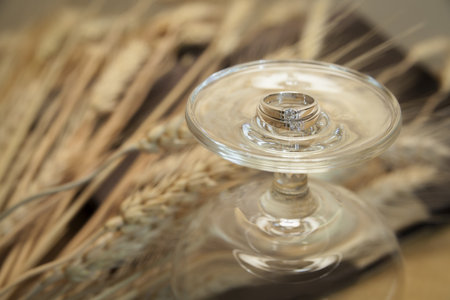 Wedding rings on a glass. - Close upの写真素材
