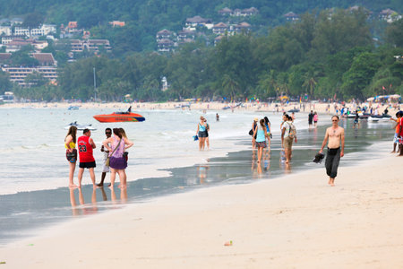 PHUKET, THAILAND - October 3, 2015: Unidentified of tourists relaxing on the Patong beach in Phuket, Thailand.のeditorial素材