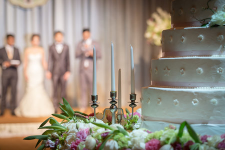 Candlestick with beautiful flowers decorations in wedding ceremony.の写真素材